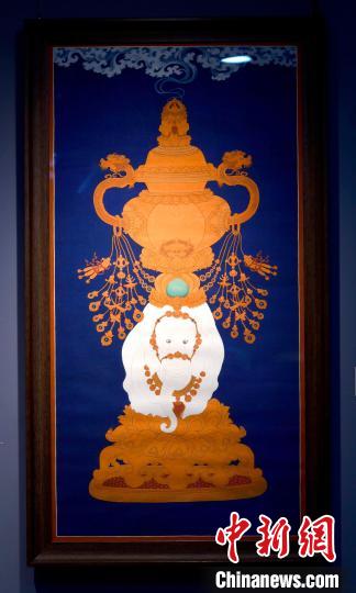 圖為5月16日，展覽中的新創(chuàng)唐卡作品《瑞象承香》?！±盍?攝